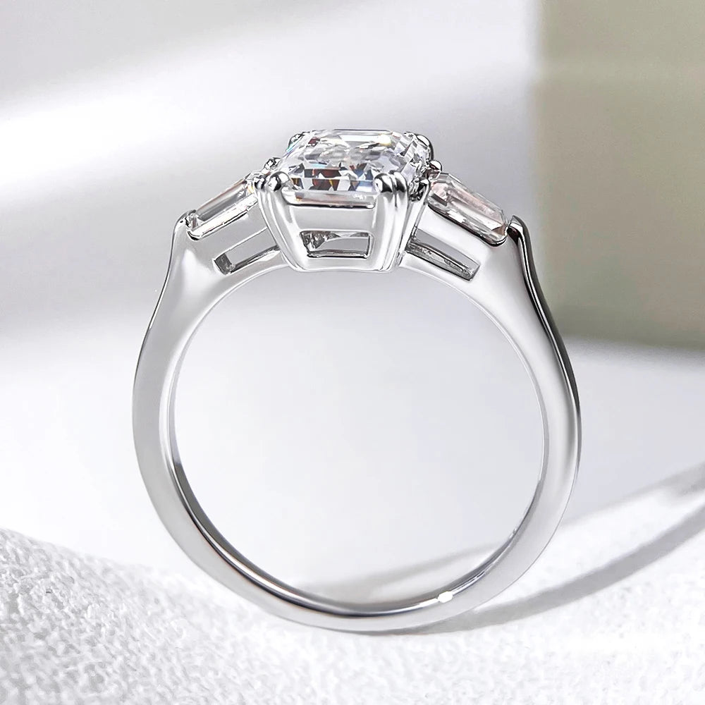 Emerald cut moissanite three-stone engagement ring in white gold — SARAB Jewelry — detail 4
